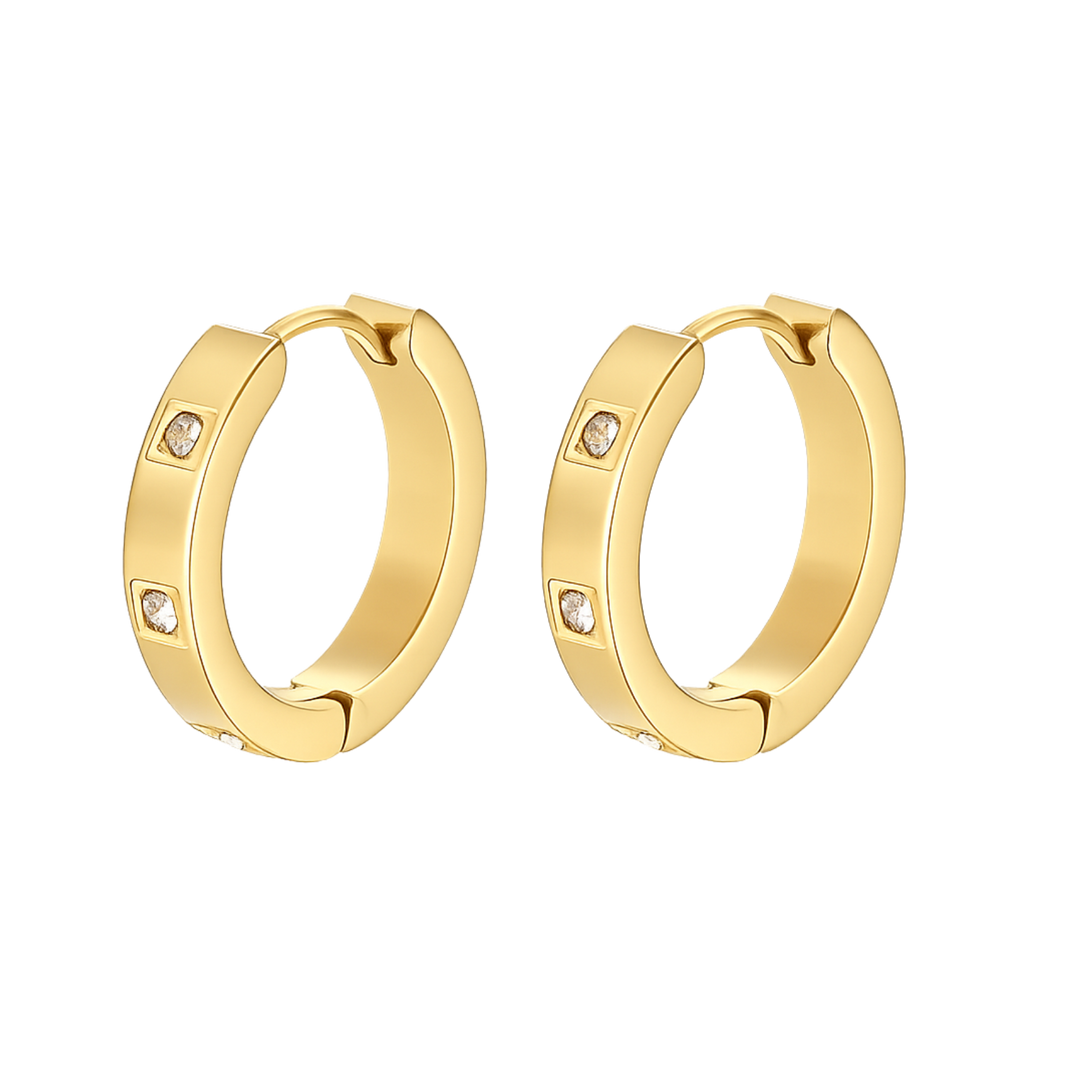 Gold hoop earrings with small diamonds on a white background