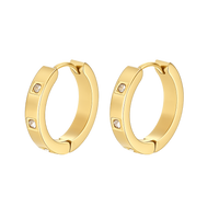 Gold hoop earrings with small diamonds on a white background
