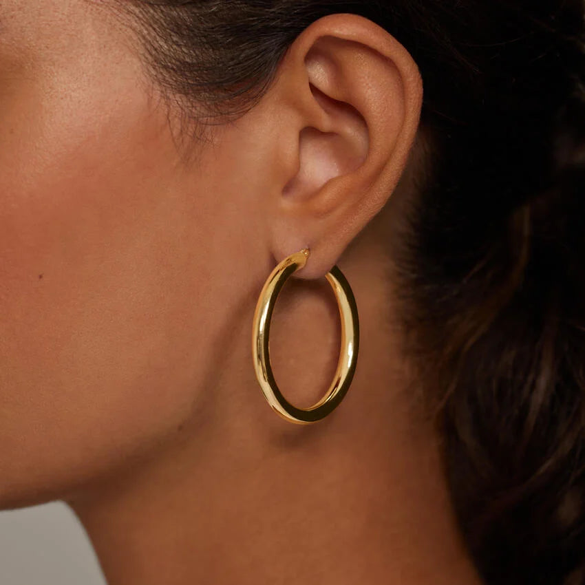 gold hoops on model