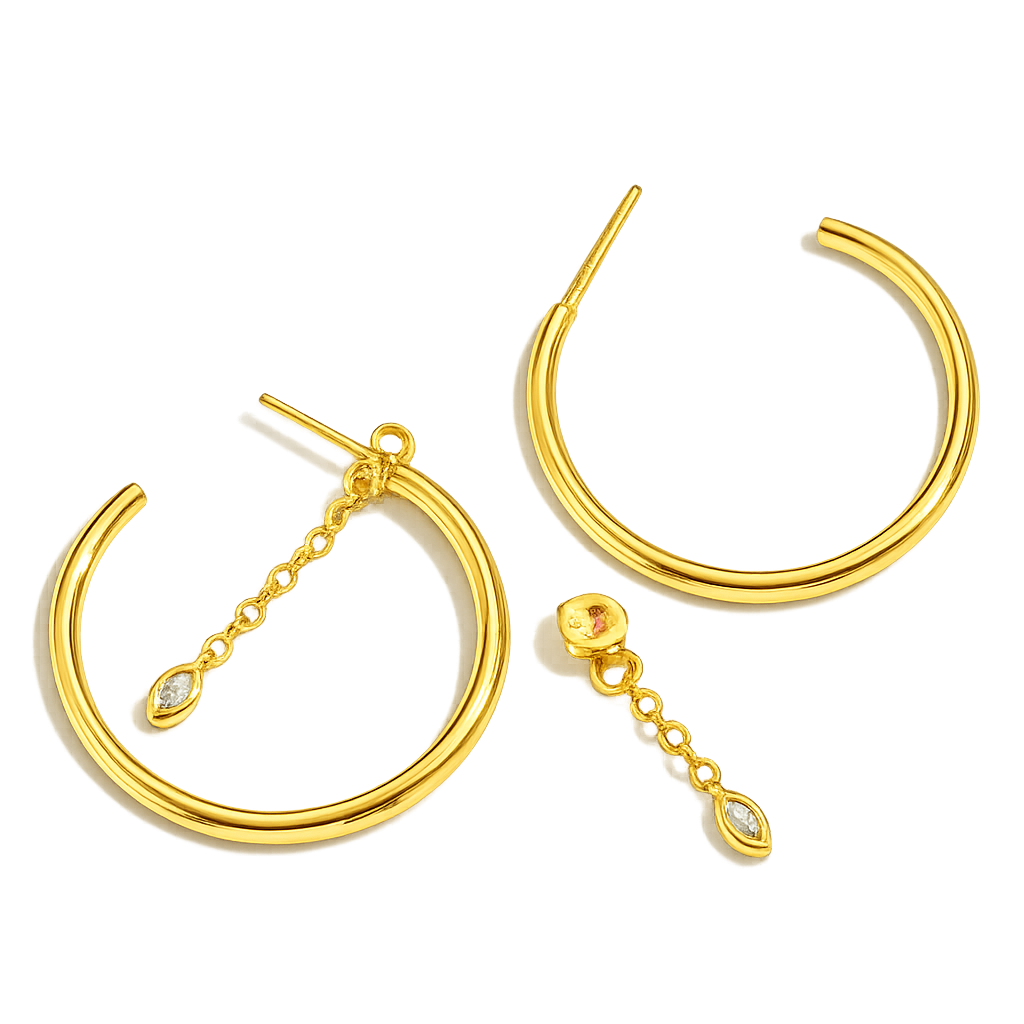 Gold hoop earrings with chain and gemstone details on a white background
