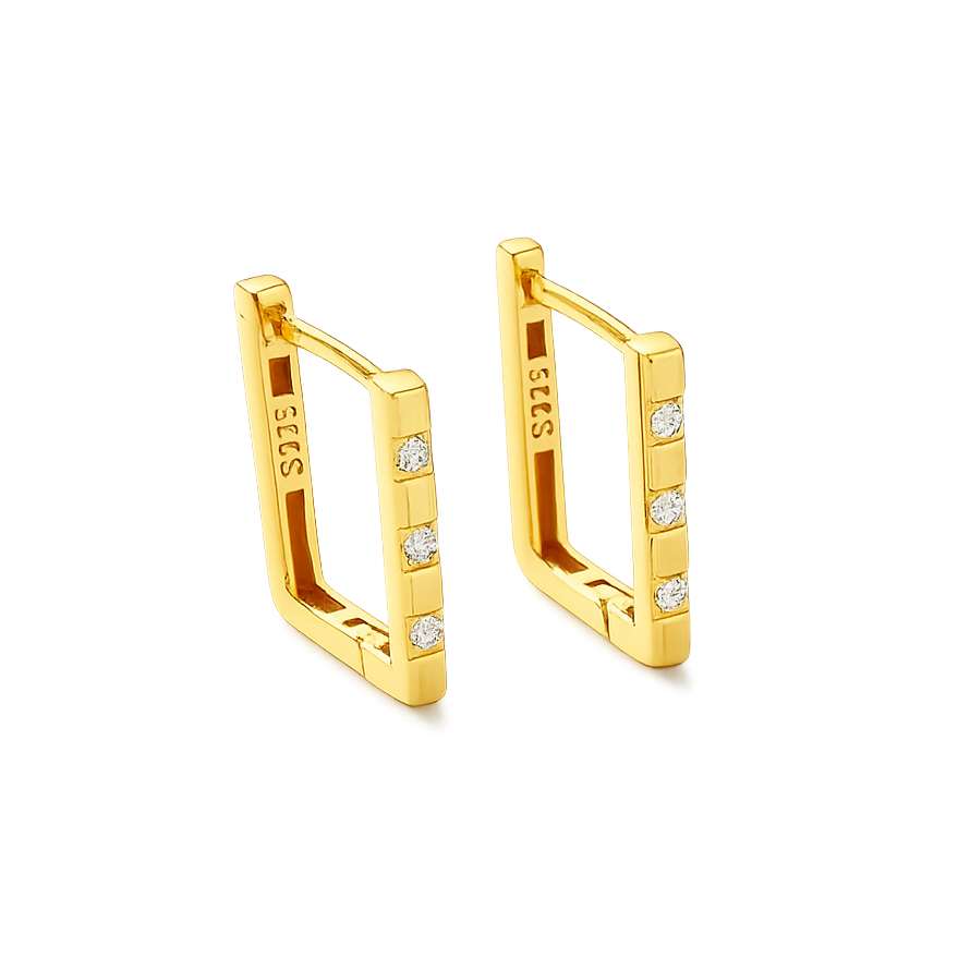 Gold earrings with diamond accents on a black background