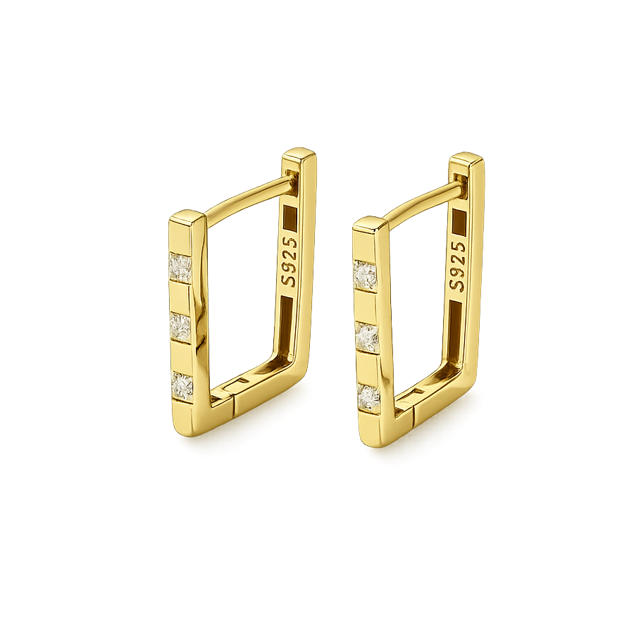 Gold hoop earrings with embedded diamonds on a clear background