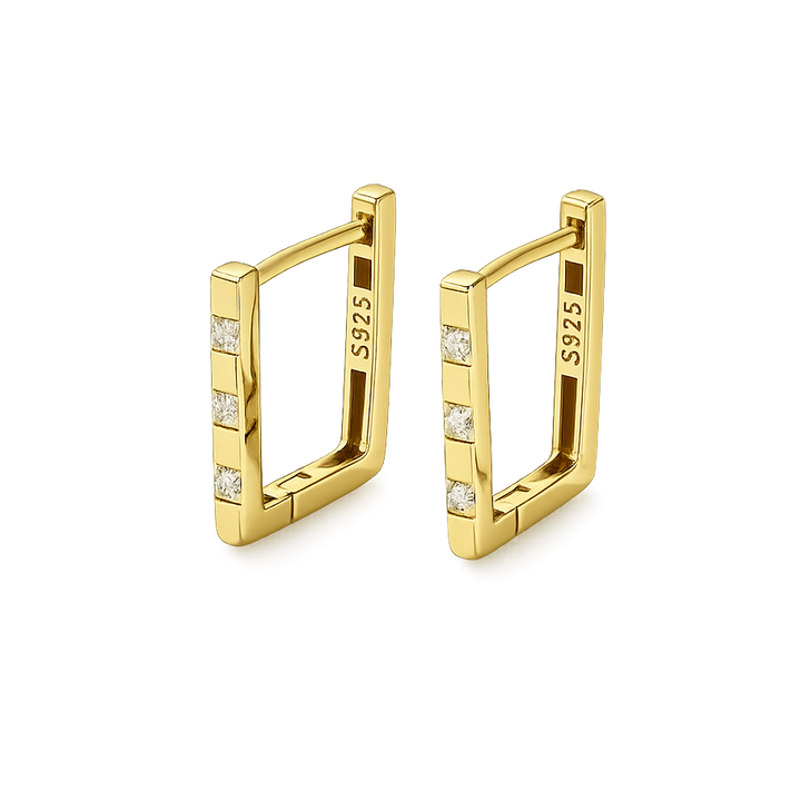 Gold hoop earrings with embedded diamonds on a clear background