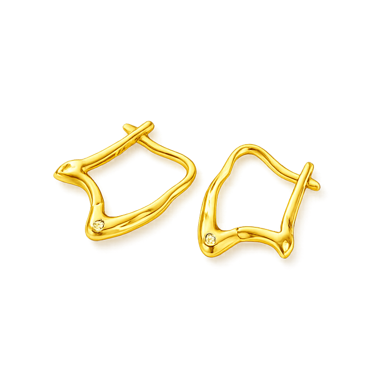 Gold earrings on a white background