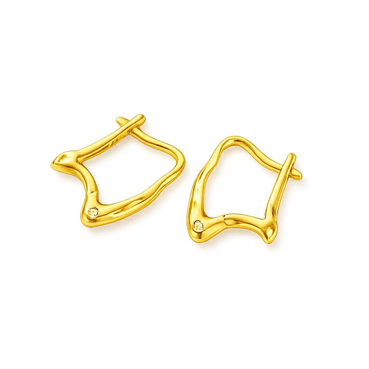 Gold earrings on a white background