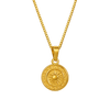 Gold necklace with a round pendant on a white background
