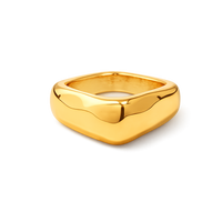 Chunky gold ring with a square design on a white background