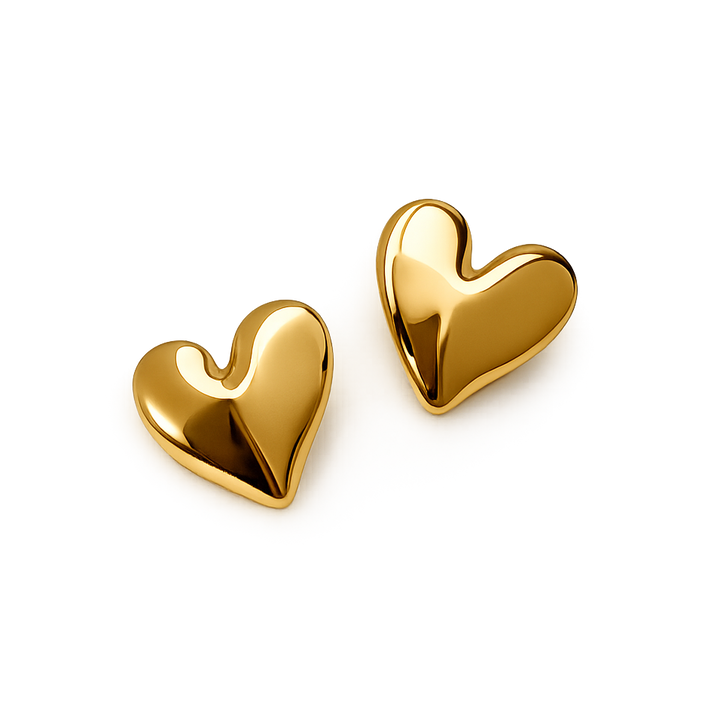Gold heart-shaped earrings on a white background