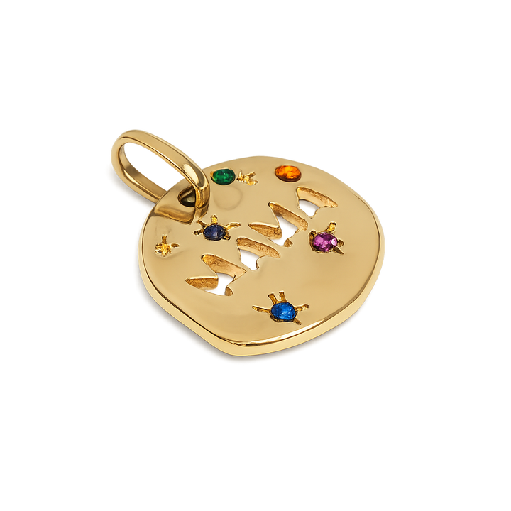 Gold heart-shaped pendant with engraved design and colorful gemstones on a white background