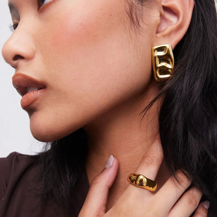 chunky gold ring on model