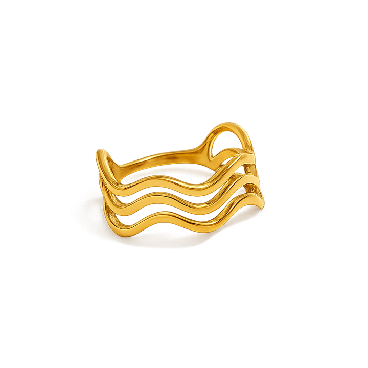 Gold ring with wavy design on a white background