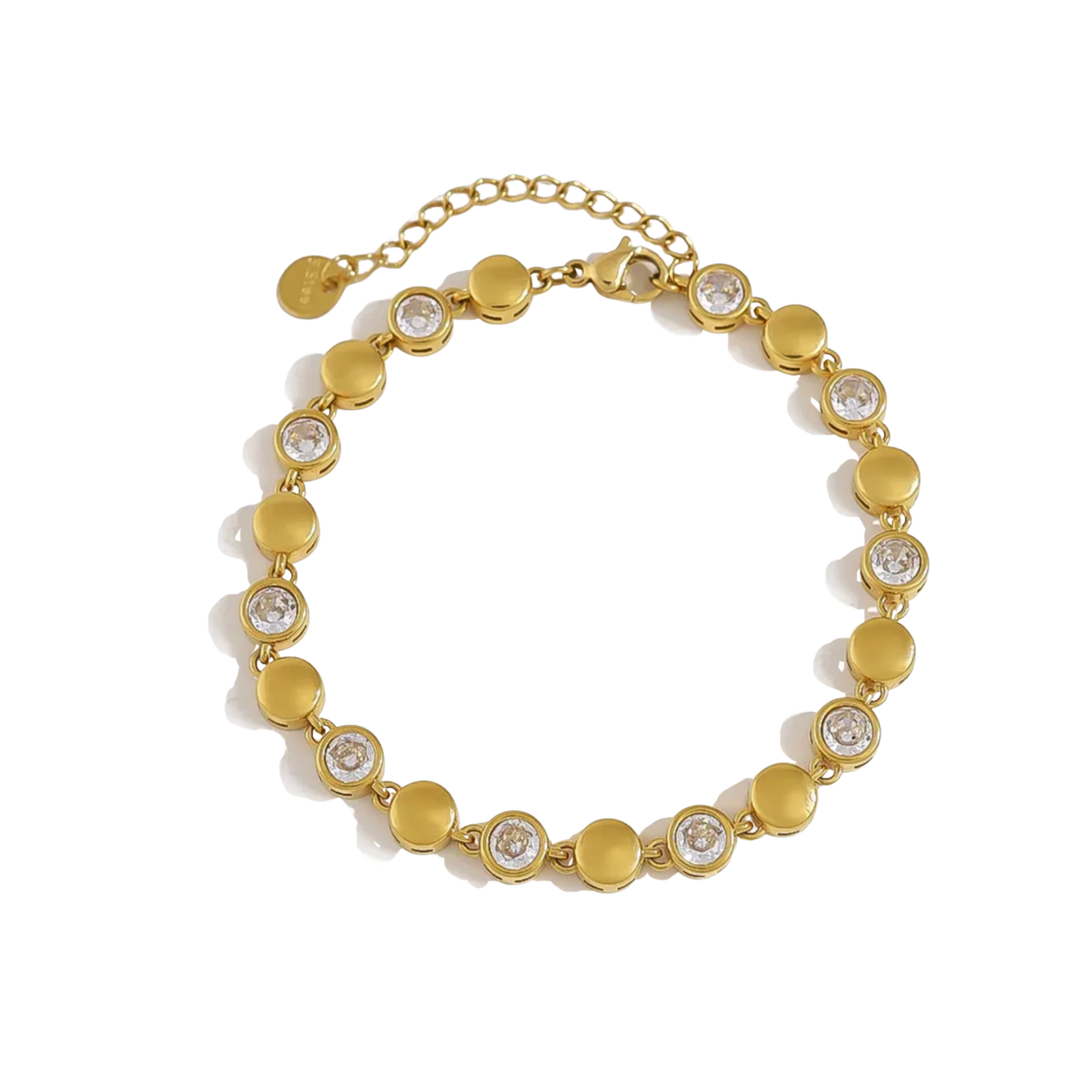 A gold-plated beaded bracelet featuring alternating flat round discs and circular settings with clear round-cut stones, displayed on a clean white background.