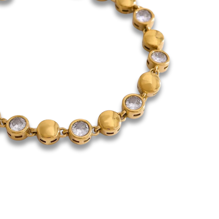 A close-up of a gold chain bracelet featuring round bezel-set clear stones, shown against a plain white background.