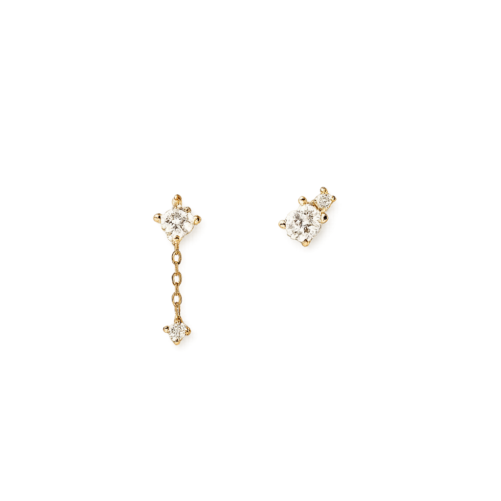 Gold earrings with diamond accents on a white background