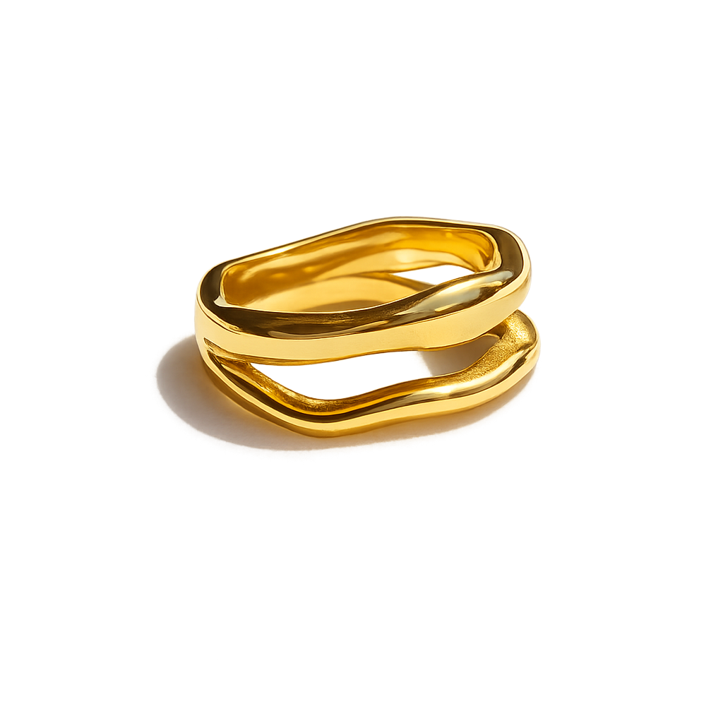 Gold ring with a wavy design on a white background
