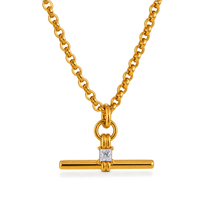 A gold chain necklace with a bar pendant featuring a square clear gemstone, shown on a clean white background.
