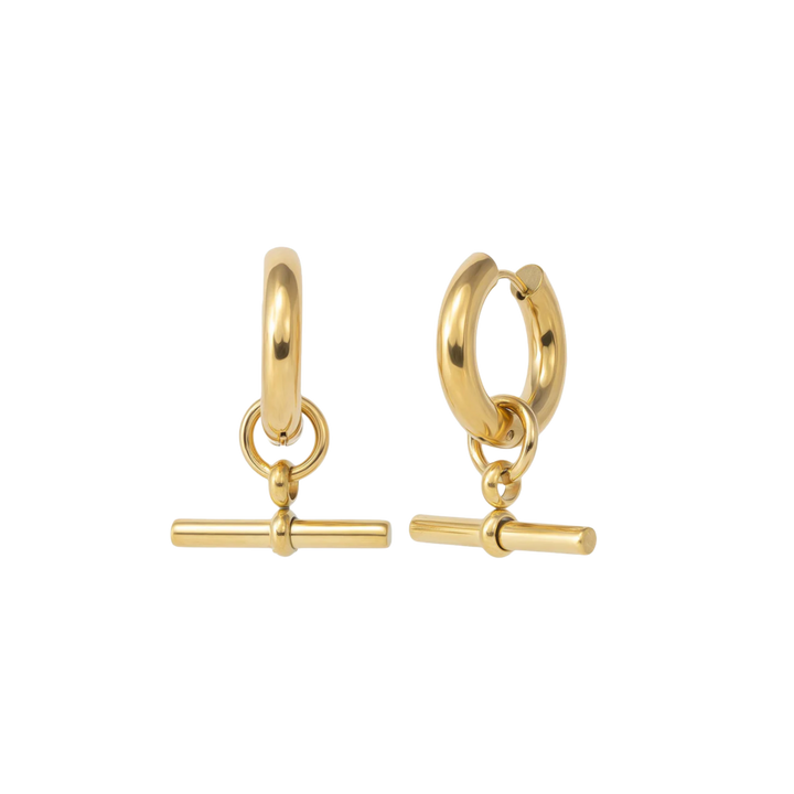 Gold hoop earrings with bar charms on a white background