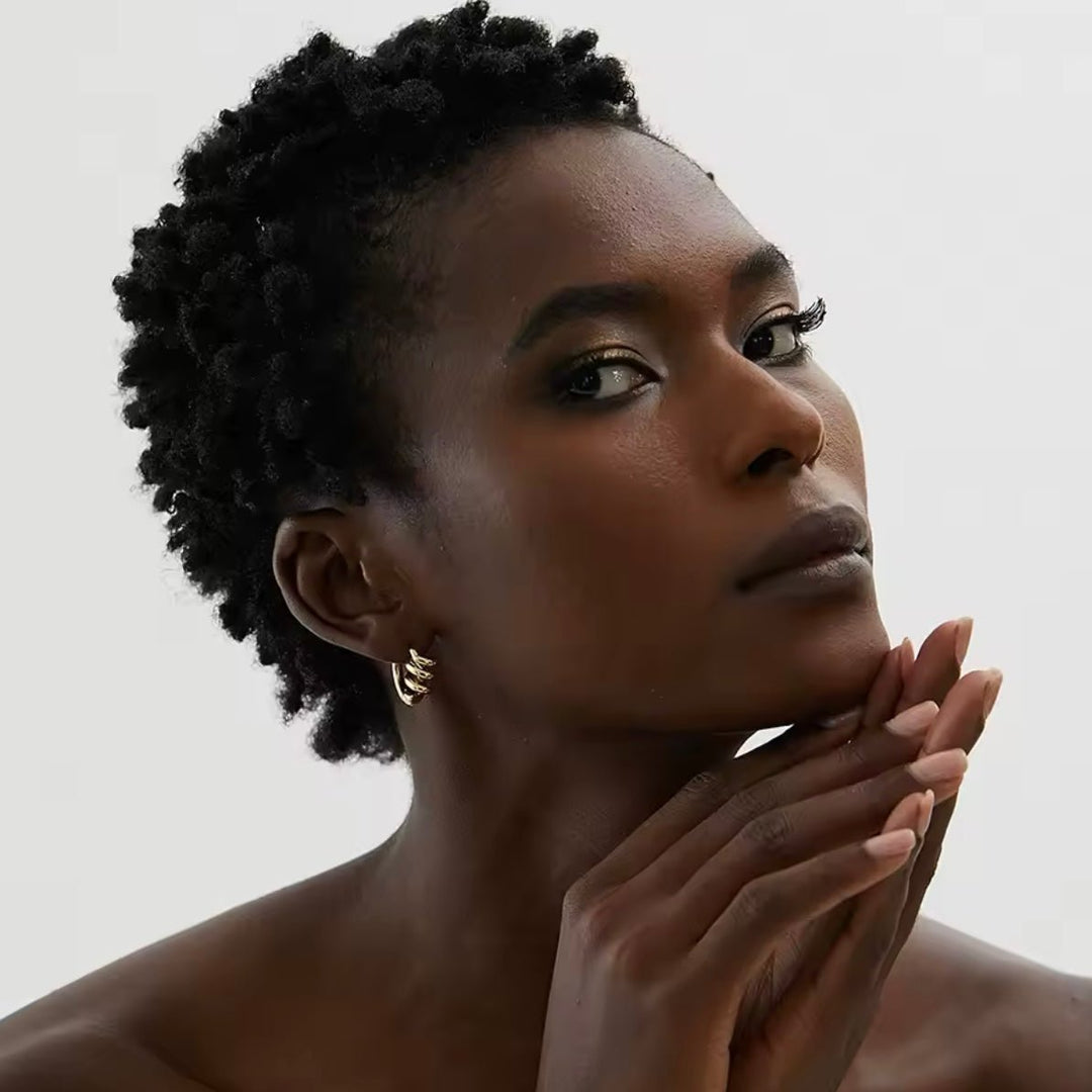 Twisted Hoops in gold on model