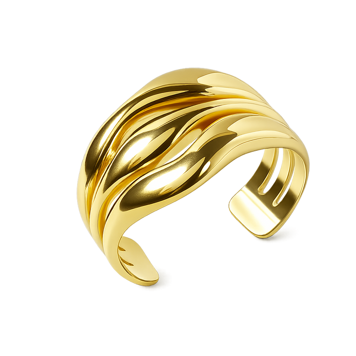 Gold bracelet with wavy design on a white background