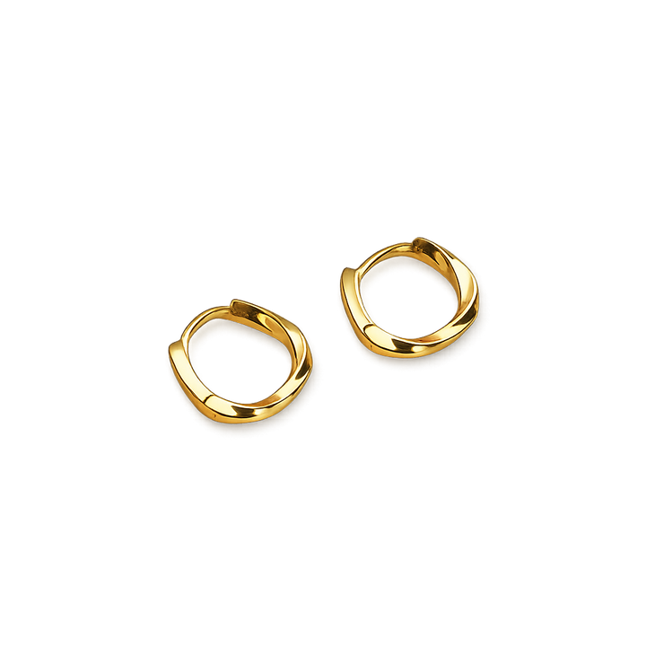Gold hoop earrings on a white background