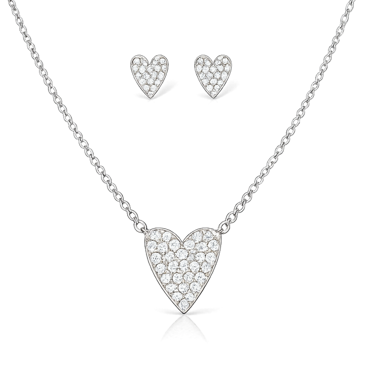 Heart-shaped necklace and earrings set on a white background