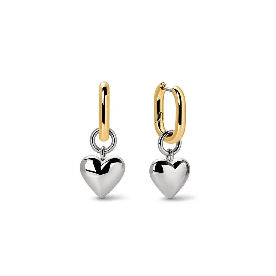 A pair of gold and silver dangle earrings on a clean white background. Each earring features a polished silver heart charm suspended from a gold huggie hoop.