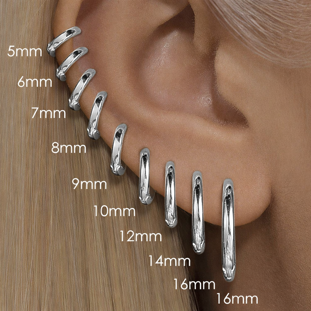 Silver hoop earrings displayed on an ear with size measurements.