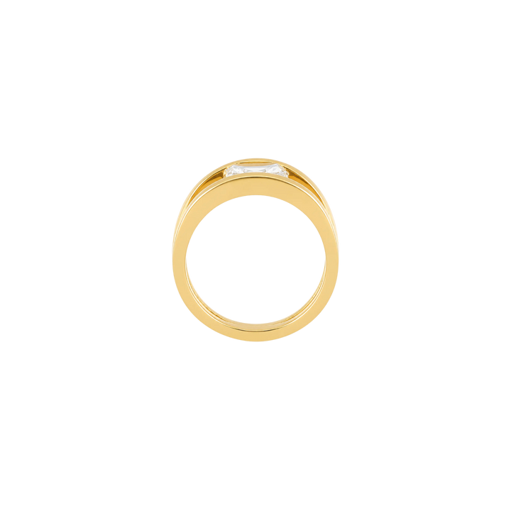 A gold ring with a small rectangular clear gemstone, shown from a top-down view on a plain white background.