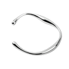 Silver bangle on a white background