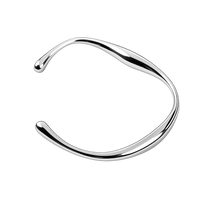 Silver bangle on a white background