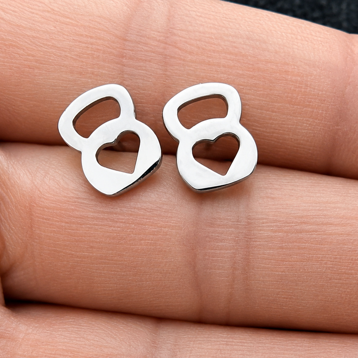 Silver earrings shaped like the number 88 on a person's hand.