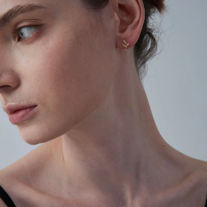 tiny leaf studs on model 