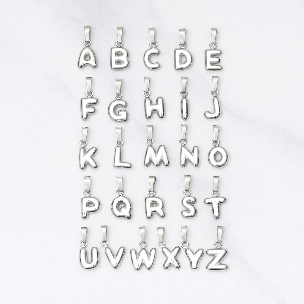 Silver letter pendants from A to Z on a white background