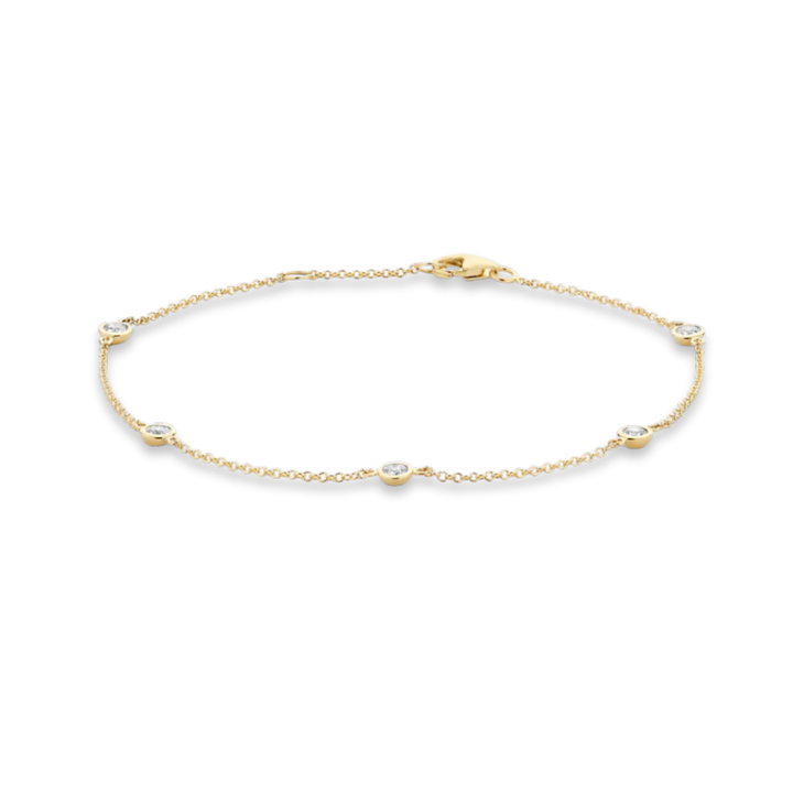 Gold bracelet with small diamonds on a white background