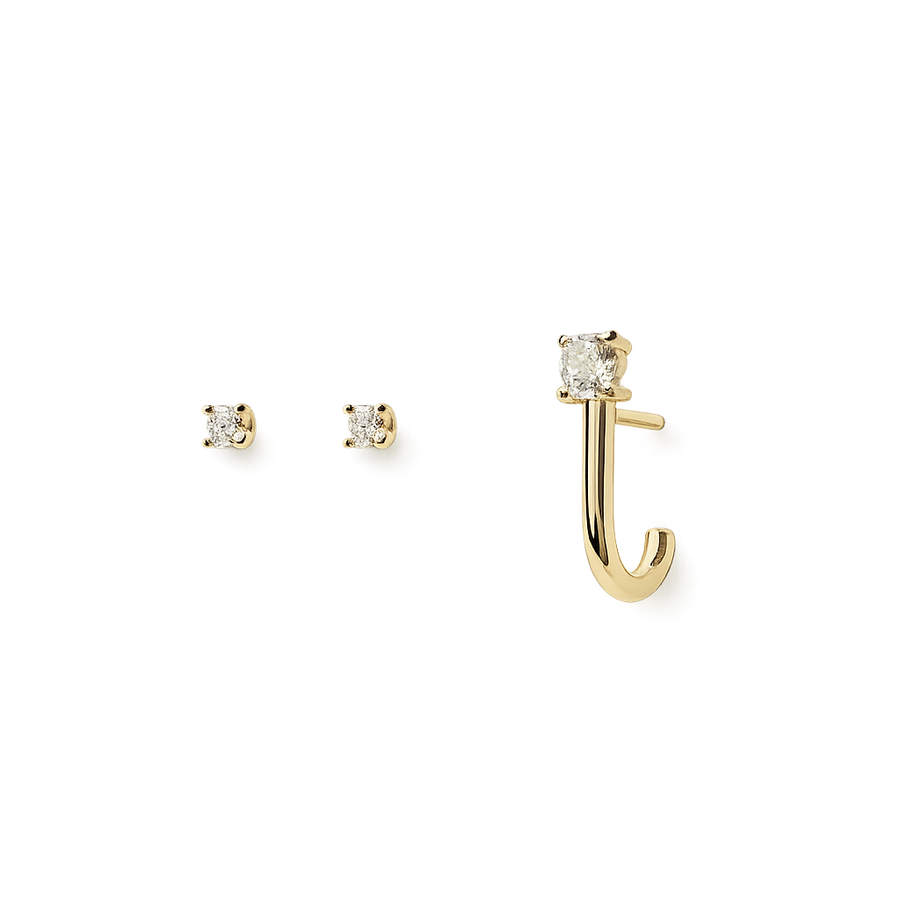 Gold earring and matching stud earrings on a white background