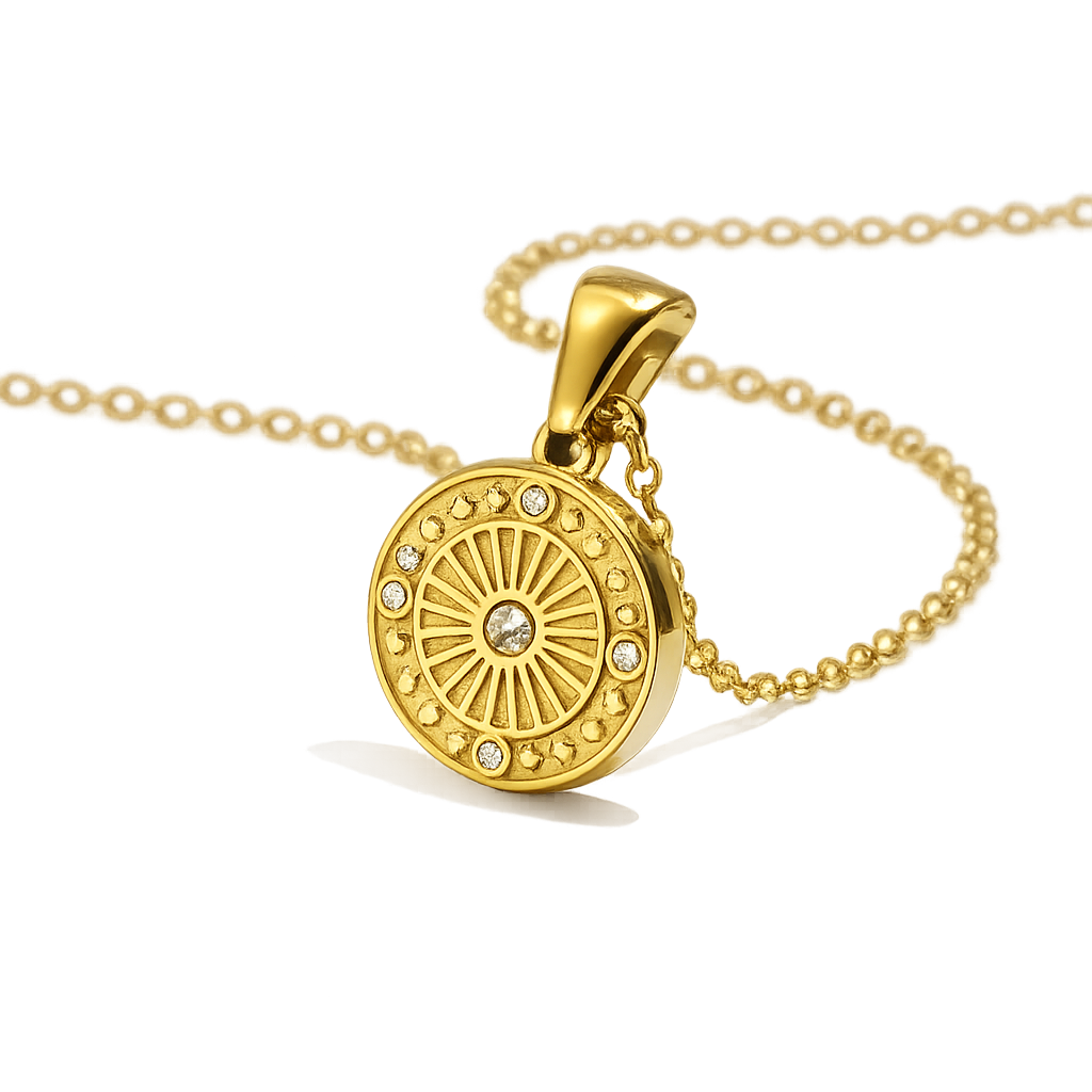 Gold necklace with a round pendant on a white background