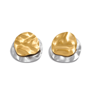 Pair of gold and silver earrings on a white background
