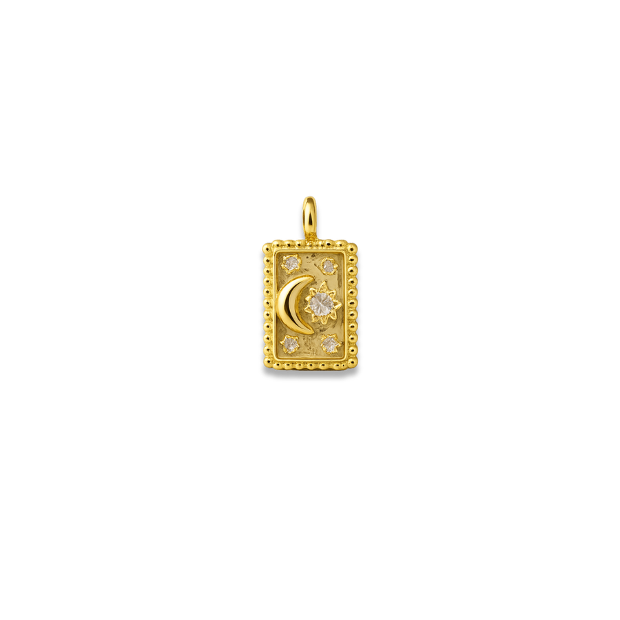 Gold pendant with moon and star design on a white background