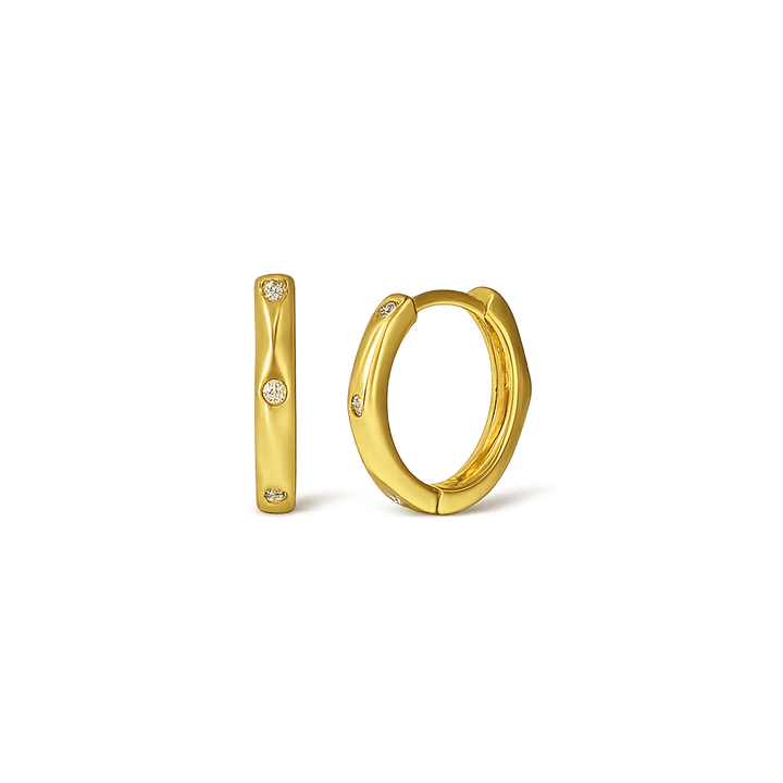 Gold hoop earrings on a white background