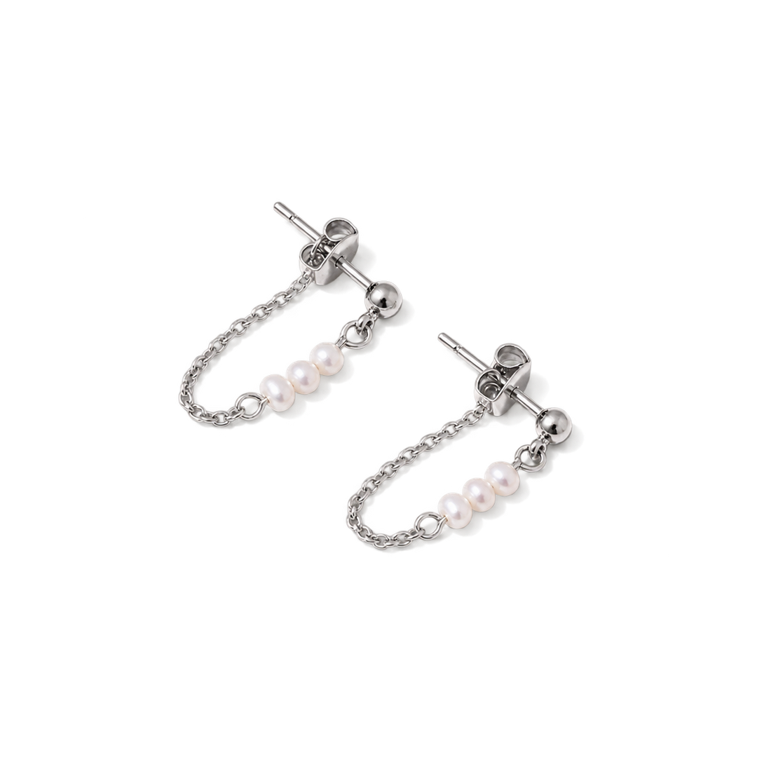 A pair of silver-toned dangle earrings with small pearl clusters on a chain, shown on a plain white background.