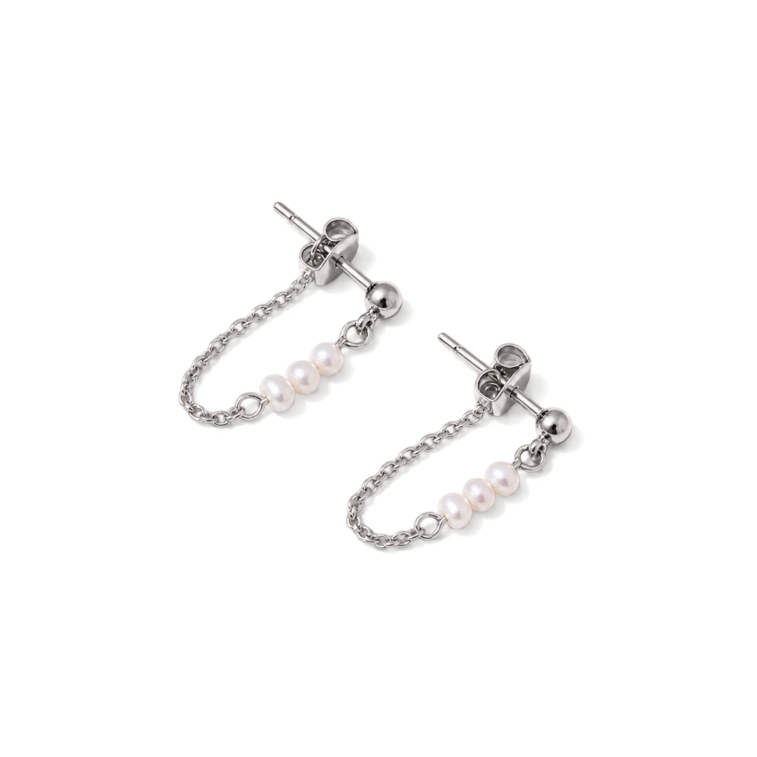 A pair of silver-toned dangle earrings with small pearl clusters on a chain, shown on a plain white background.