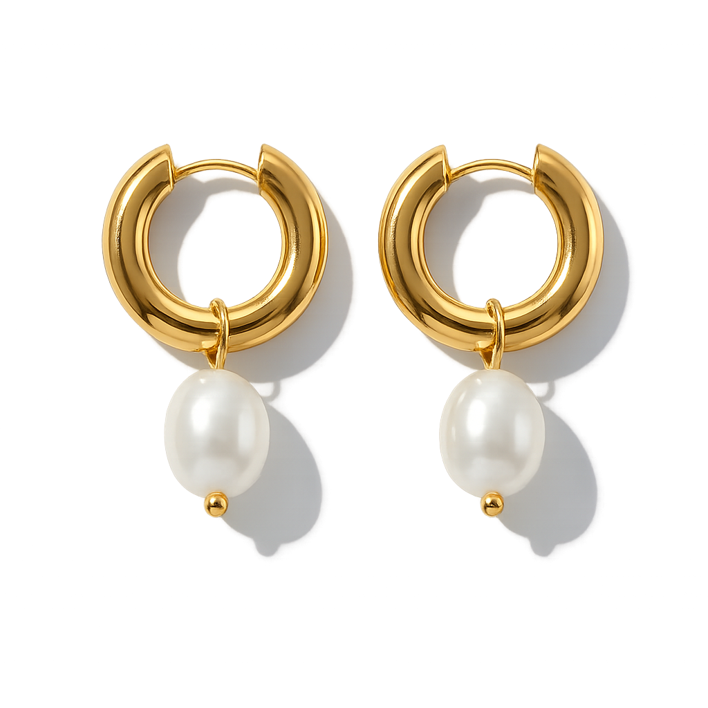 Gold hoop earrings with pearl drops on a white background