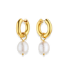 Gold hoop earrings with pearl drops on a white background