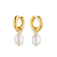 Gold hoop earrings with pearl drops on a white background