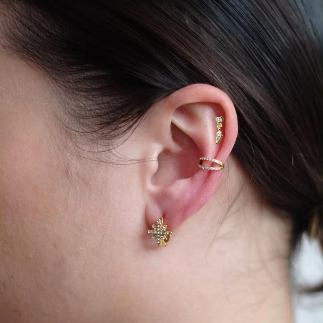 Glitterende platte achterkant piercing