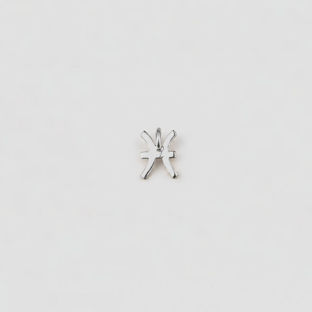 Silver star-shaped pendant on a light gray background