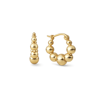 Gold hoop earrings with spherical beads on a white background