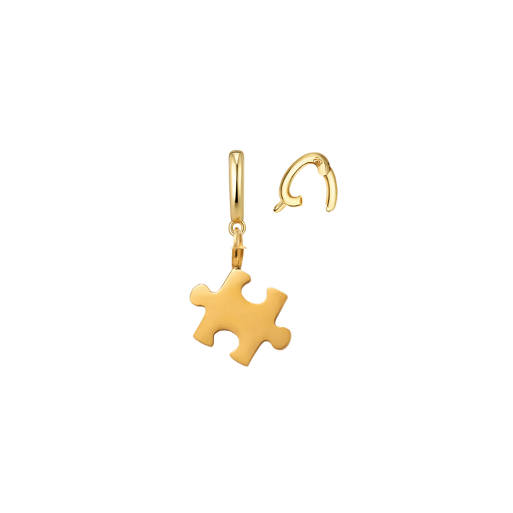 Gold puzzle piece drop earring with a matching curved post earring, shown on a plain white background.