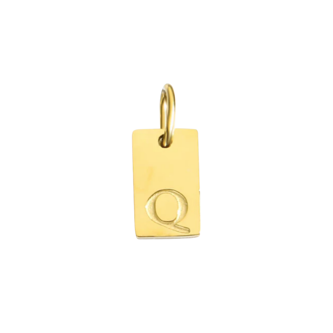 Gold pendant with letter 'Q' on a white background