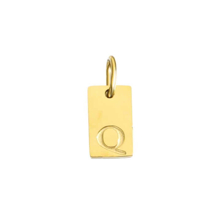 Gold pendant with letter 'Q' on a white background